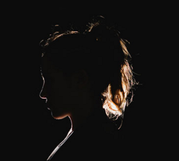 dark silhouette of teenage girl